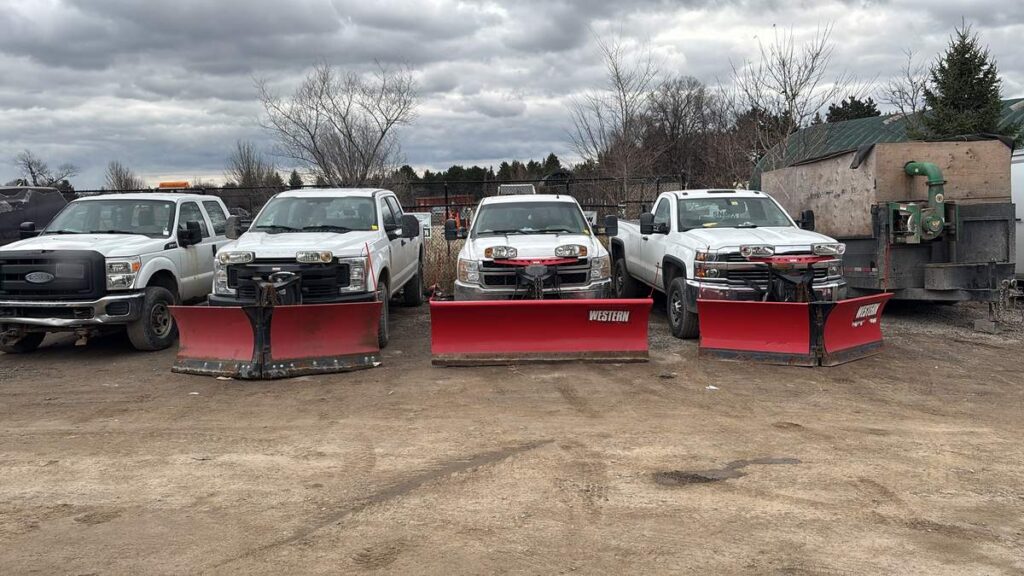 ISR Gardening's own pickup trucks fitted with Western snow plows