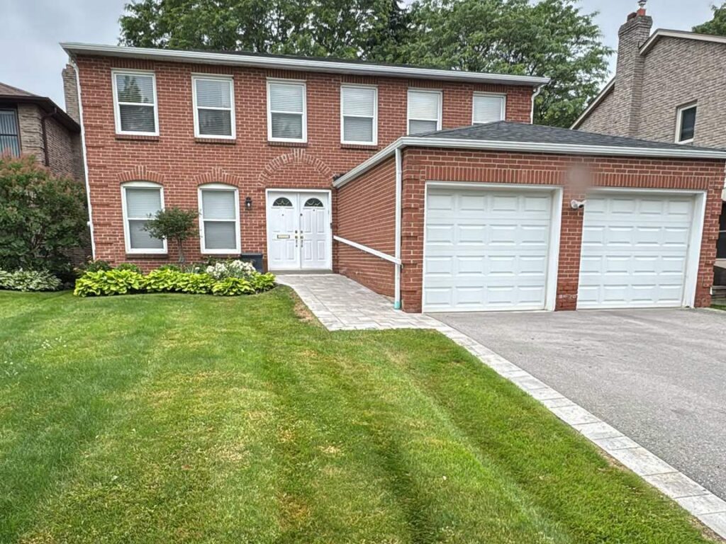 Freshly mowed striped front lawn in Toronto