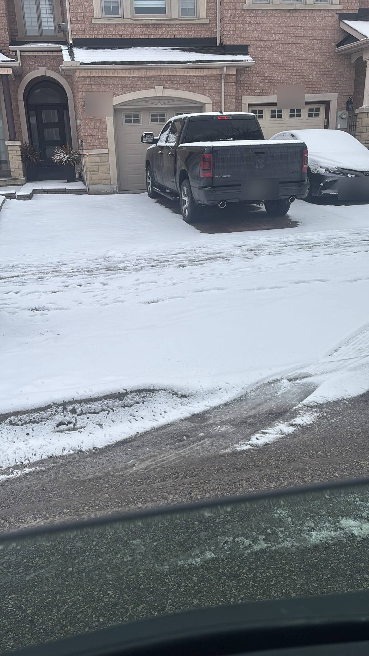 Residential driveway and walkway cleared after a snowfall by ISR Gardening