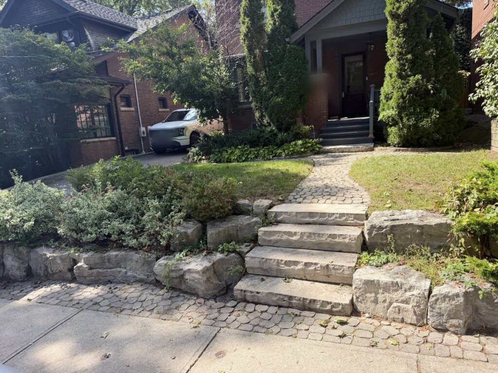 Old stone front steps and walkway before the interlocking rebuild in Toronto