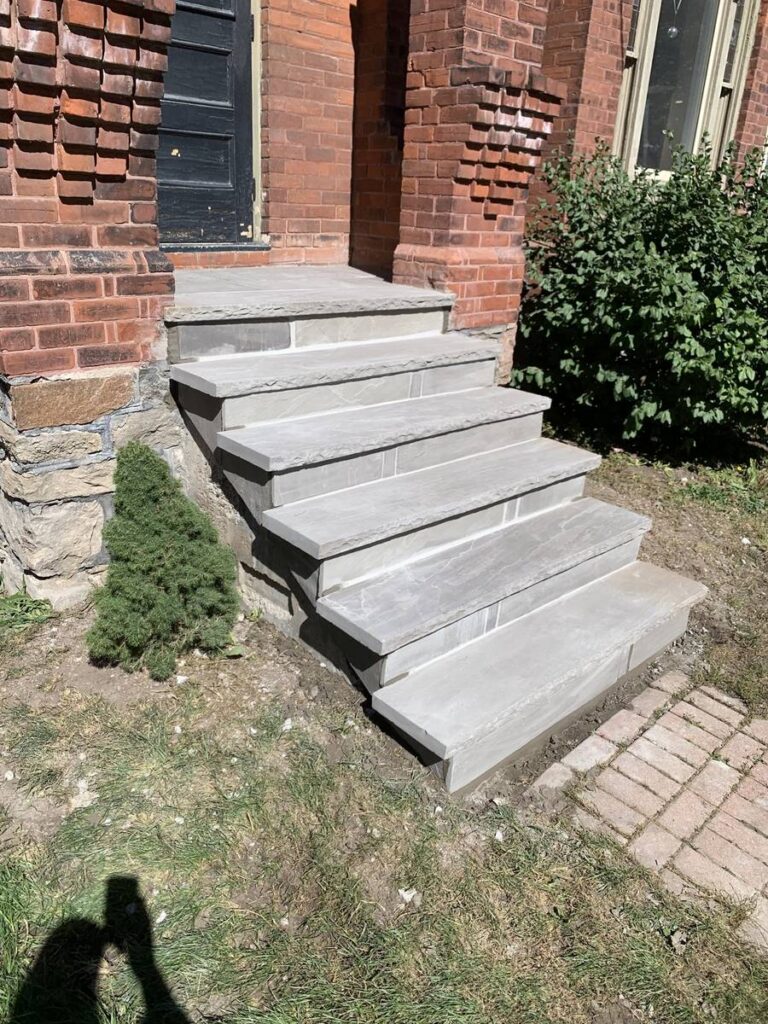 Stone slab front steps rebuilt with interlocking